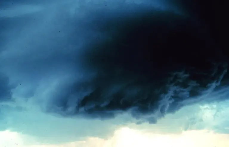 A lowered wall cloud beneath the rain-free base of a supercell
